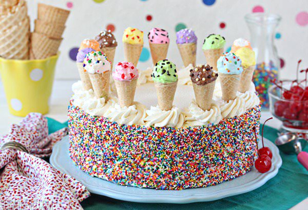 ice cream cones around a cake