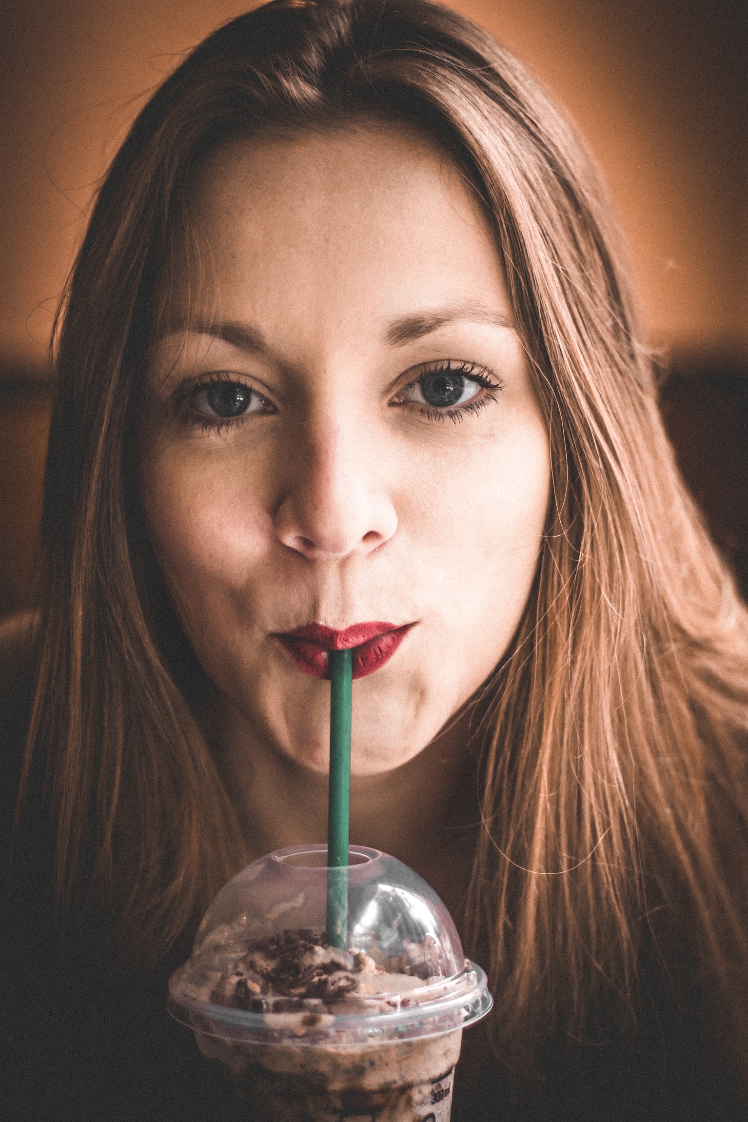woman sipping Starbucks Smoothies