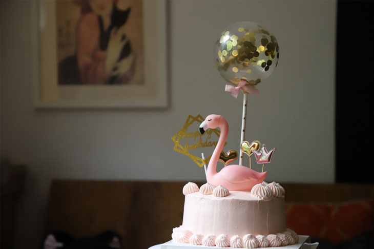 pink flamingo on top of a cake