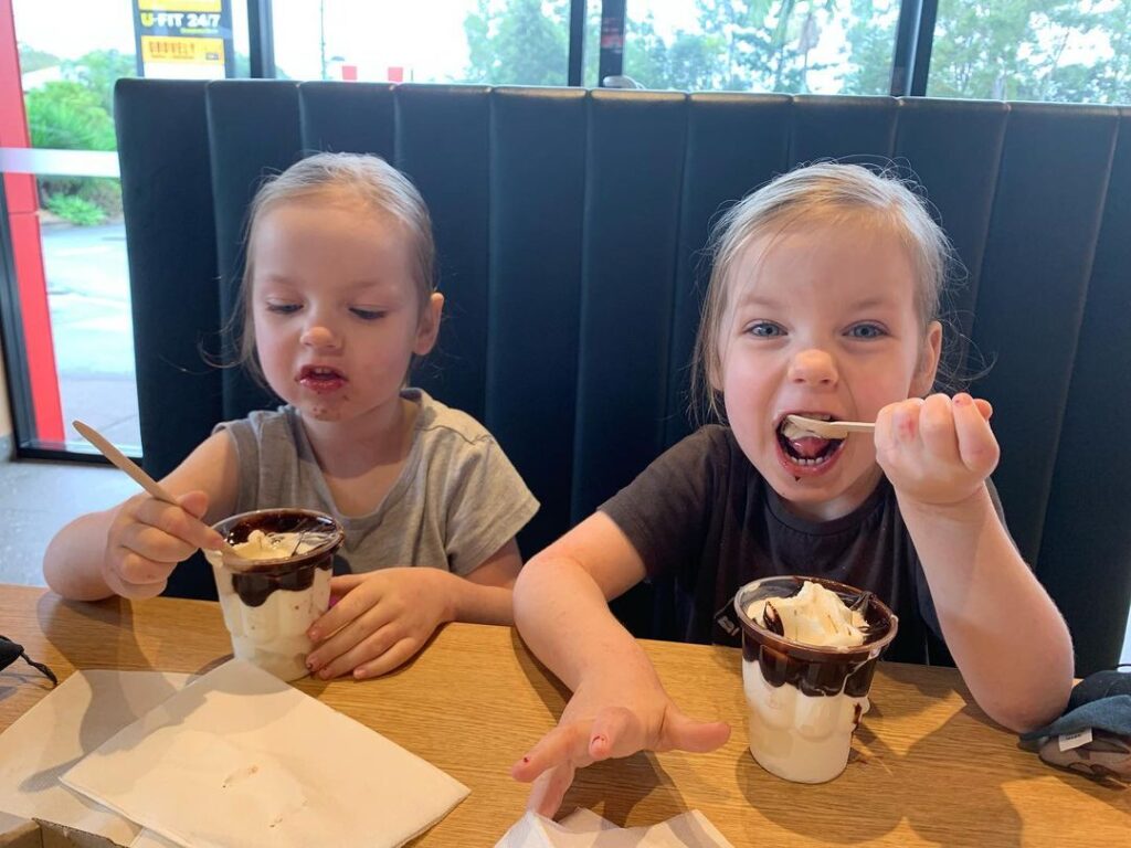 Mcdonalds Ice Cream - Two children eating a chocolate sundae